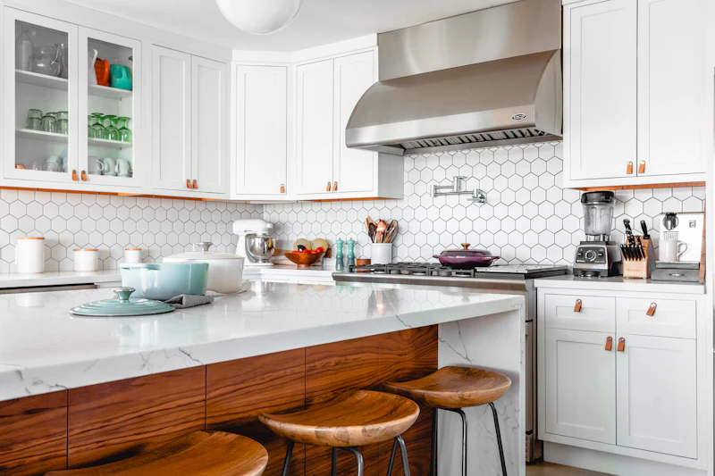 Bright white kitchen with a wood island