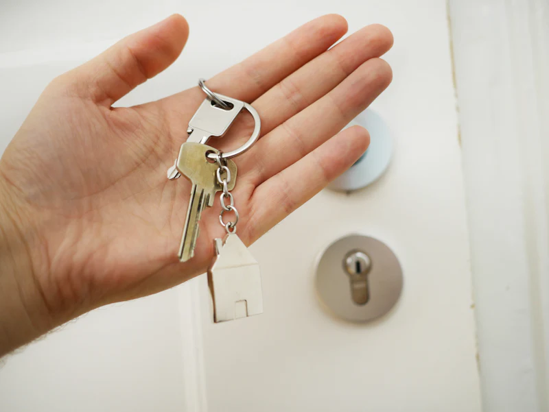 Open hand holding a set of house keys